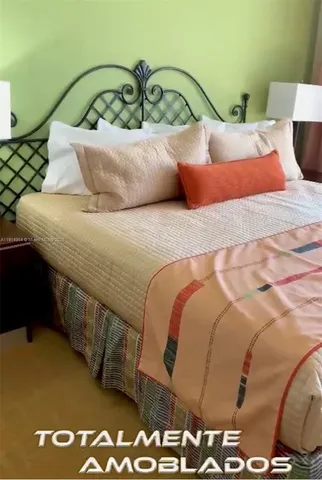 a bedroom with a bed and sky view