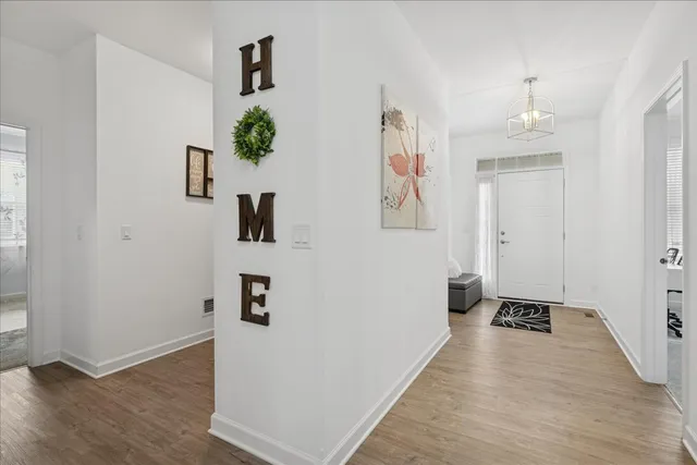 wooden floor in a white room