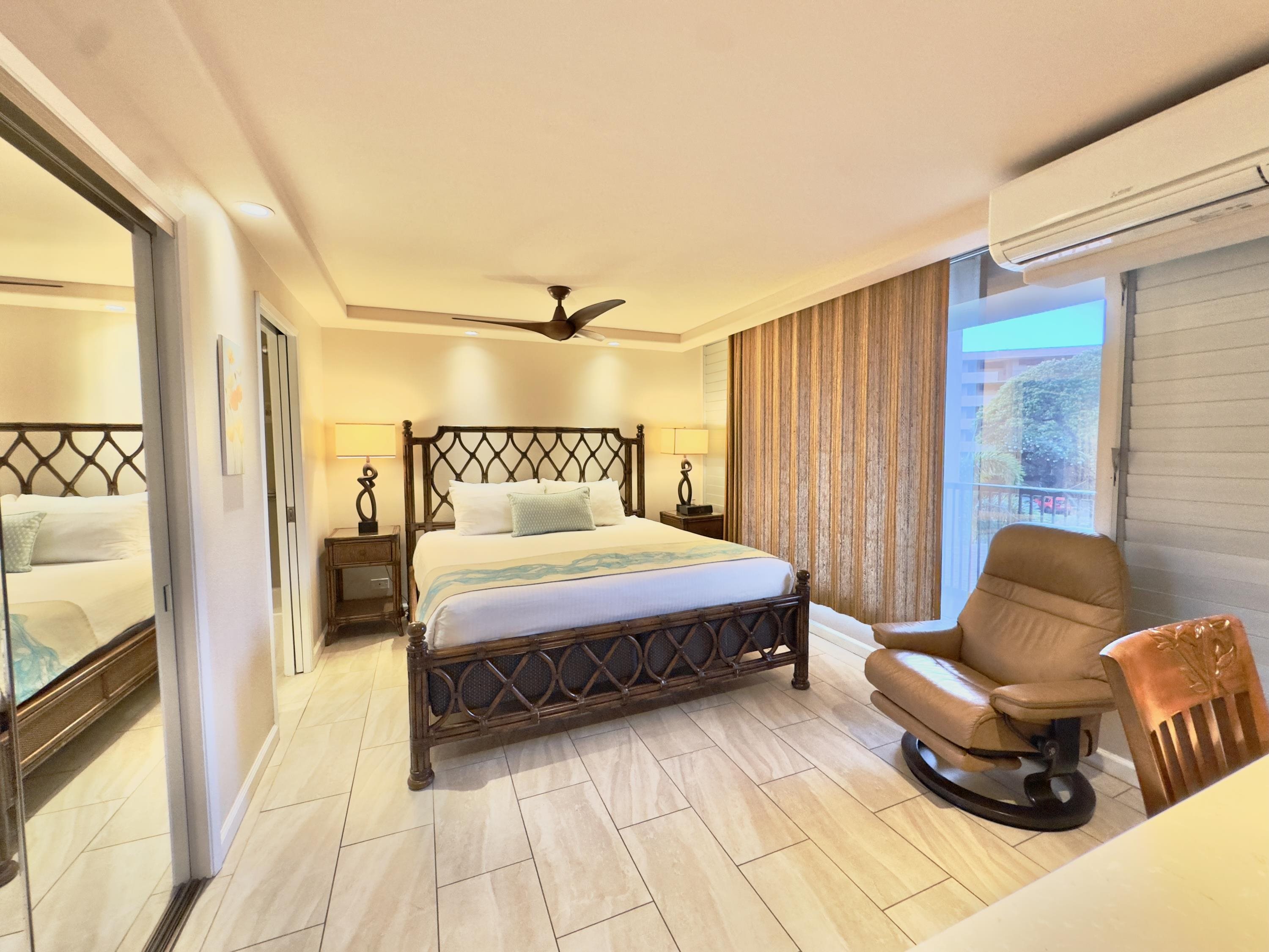 2960 South Kihei Road, Unit 209 Kihei, HI 96753 - Photo 22 of 43 a spacious bedroom with a bed and a couch