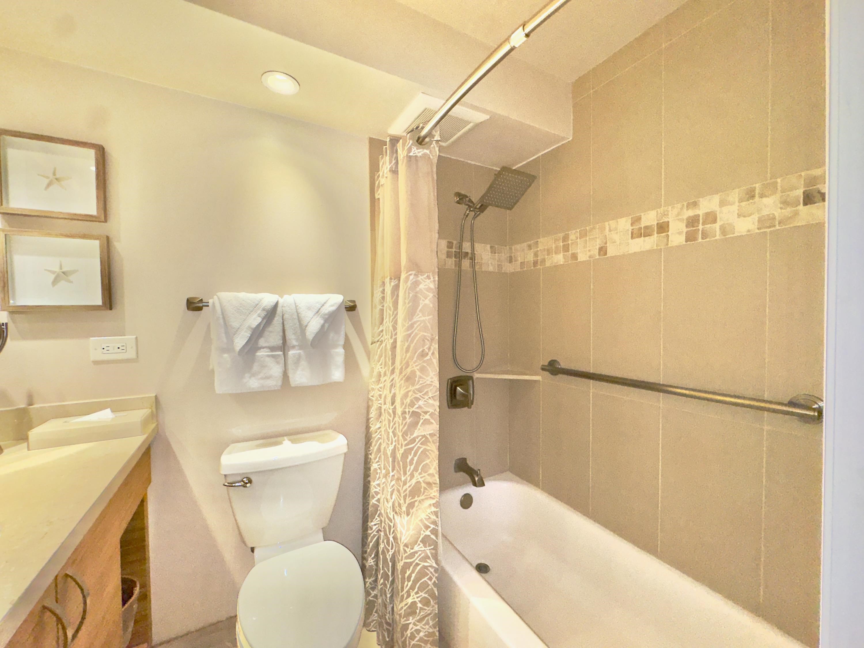 2960 South Kihei Road, Unit 209 Kihei, HI 96753 - Photo 28 of 43 a bathroom with a toilet and shower