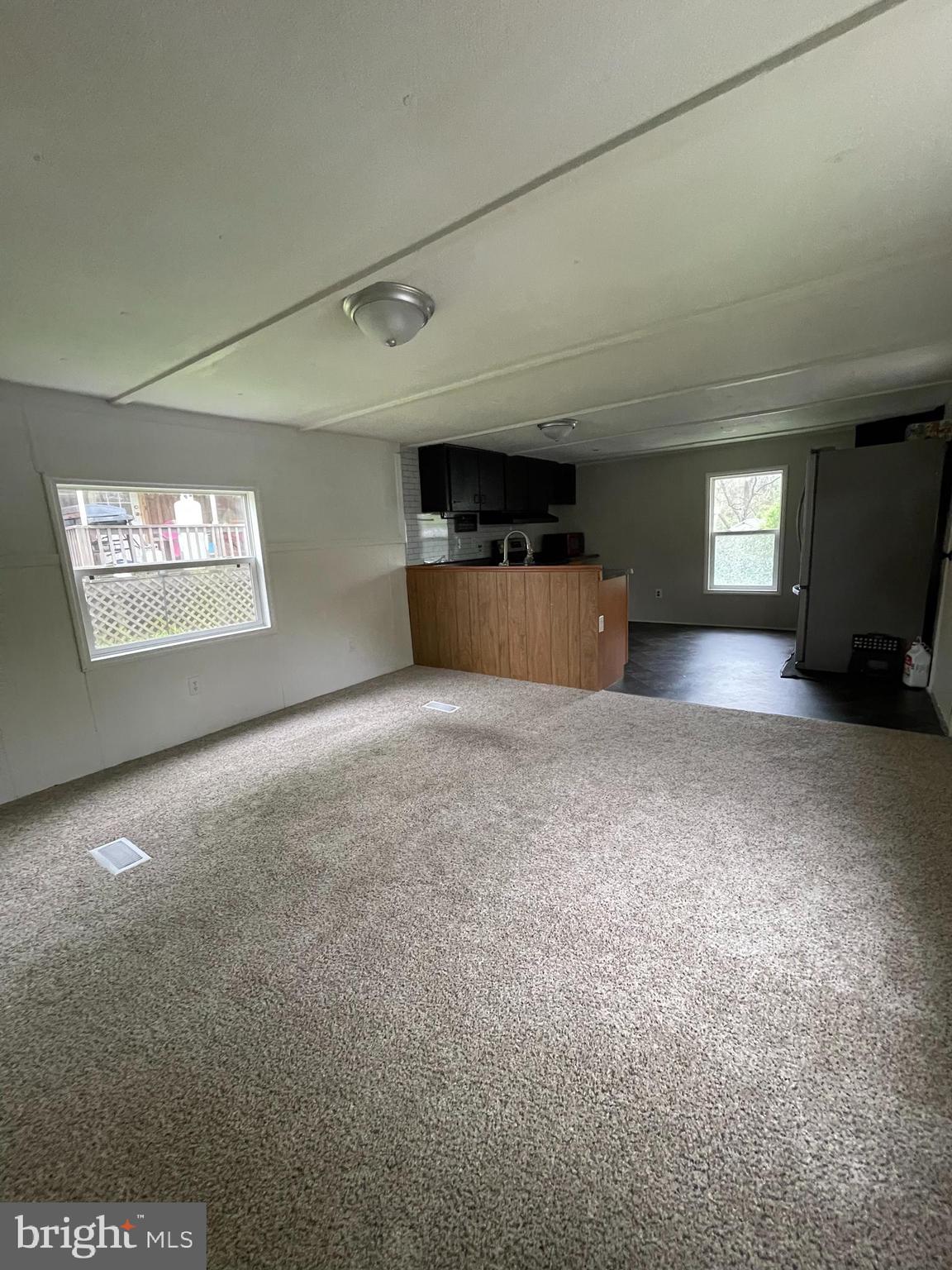 501 Windy Hill Road, Unit 153 Shermans Dale, PA 17090 - Photo 12 of 27 living room into kitchen