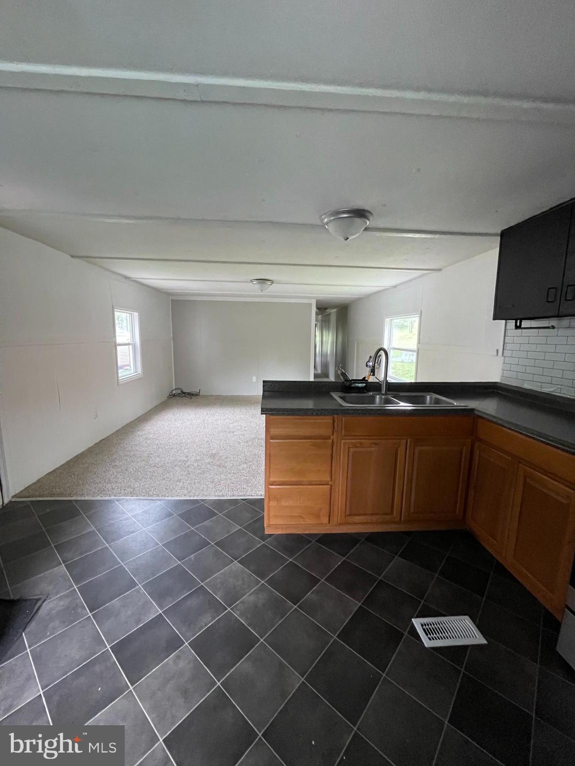 501 Windy Hill Road, Unit 153 Shermans Dale, PA 17090 - Photo 10 of 27 kitchen to living room