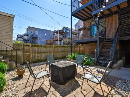a patio with table and chairs