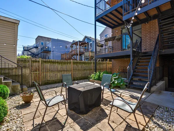 a patio with table and chairs