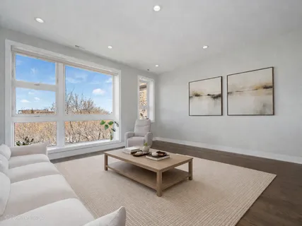 a living room with furniture and a table