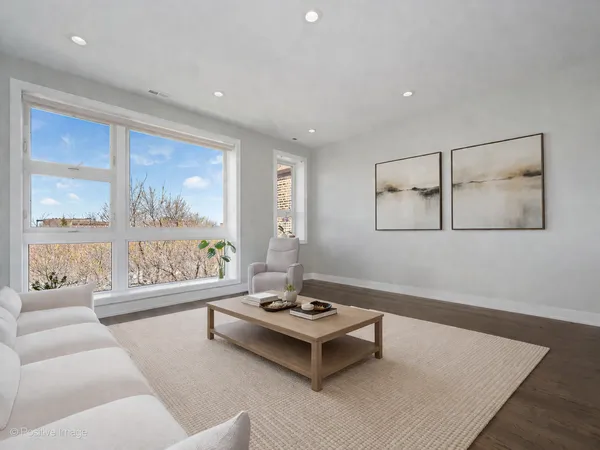 a living room with furniture and a table
