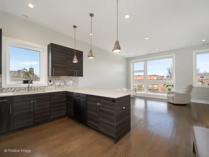 a spacious bathroom with a granite countertop sink and a large mirror