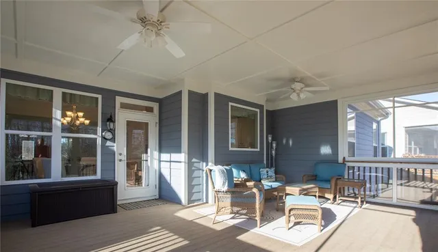 a work room with furniture wooden floor and a window