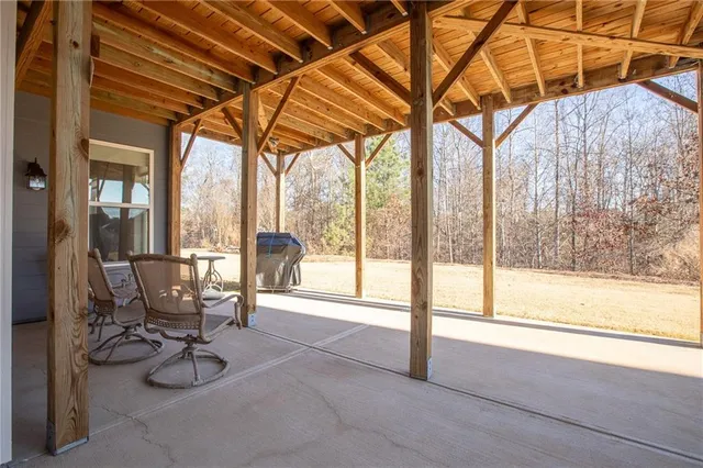 a view of a house with wooden fence