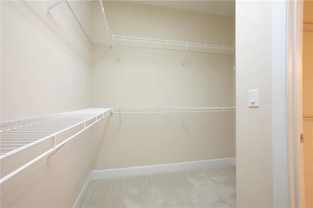 a bathroom with a toilet a sink and a mirror