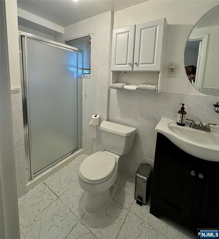 38 5th Street Closter, NJ 07624 - Photo 11 of 18 a bathroom with a sink toilet and shower