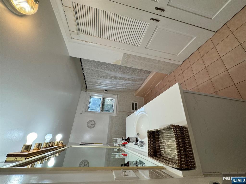 38 5th Street Closter, NJ 07624 - Photo 14 of 18 a living room with furniture and a table