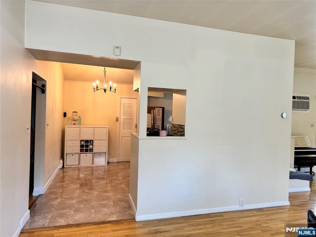 38 5th Street Closter, NJ 07624 - Photo 7 of 18 a view of a hallway with wooden floor and a bathroom