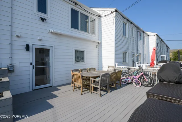 a view of a chairs and table on the deck