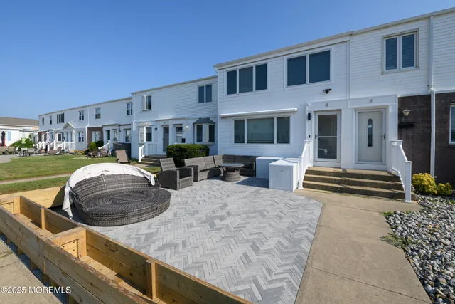 a swimming pool view with a outdoor seating