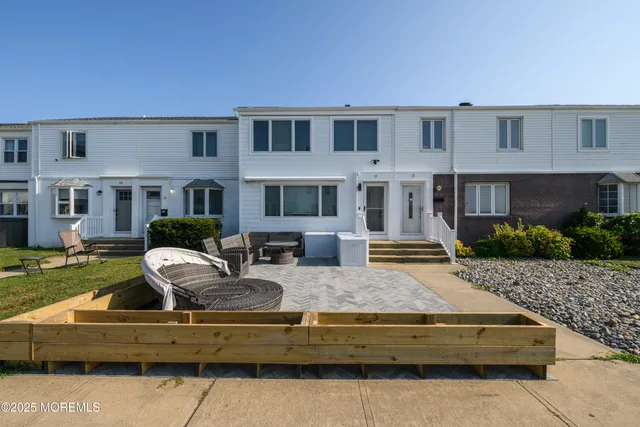 a front view of house with outdoor seating