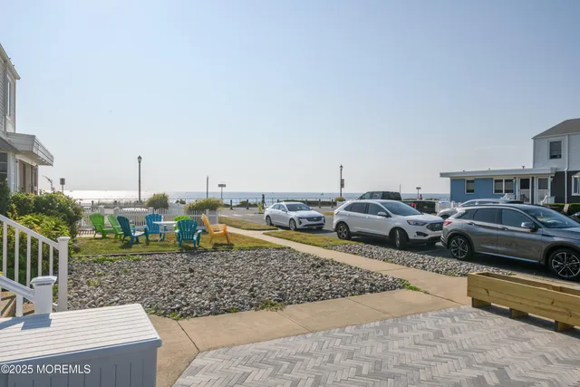 a view of a yard with cars