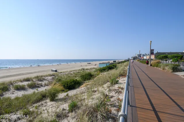a view of a swimming pool with a lawn chairs