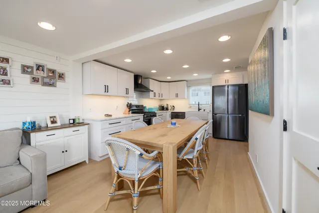 a kitchen with a table and chairs in it