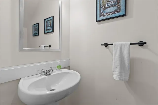a bathroom with a sink and mirror