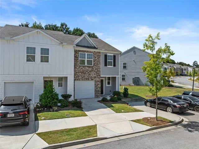 a front view of a house with a yard