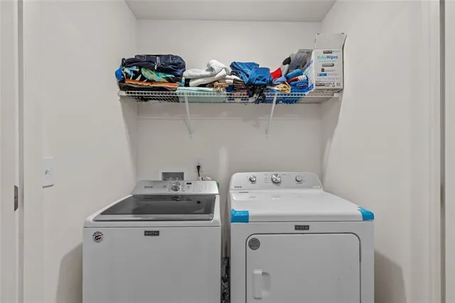 a utility room with dryer and washer