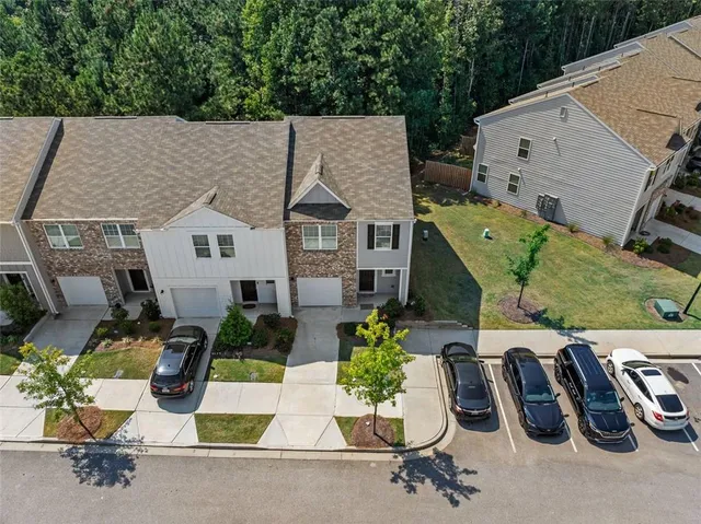 a view of a patio with table and chairs potted plants
