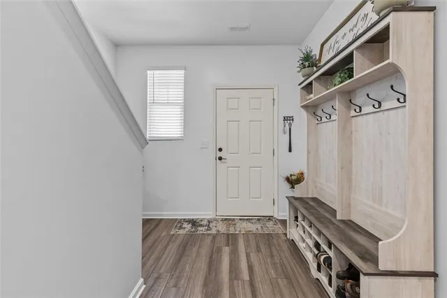 a view of an entryway with wooden floor