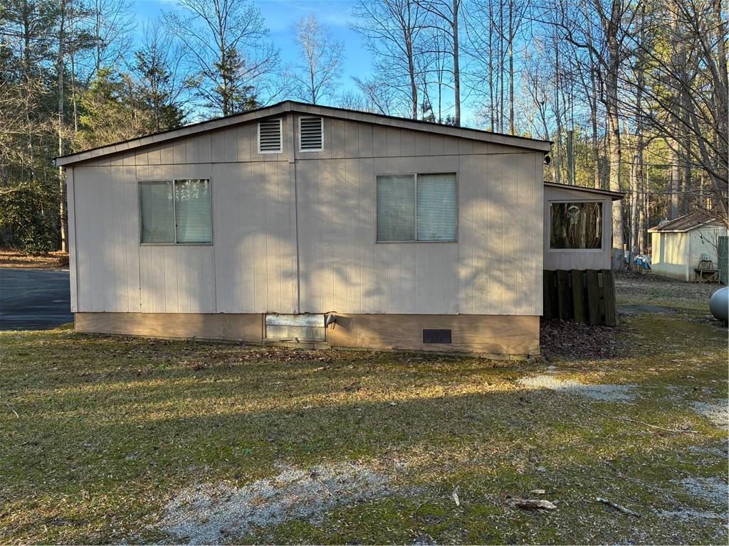 208 Manors Mill Road Dallas, GA 30157 - Photo 14 of 26 a front view of a house with a yard