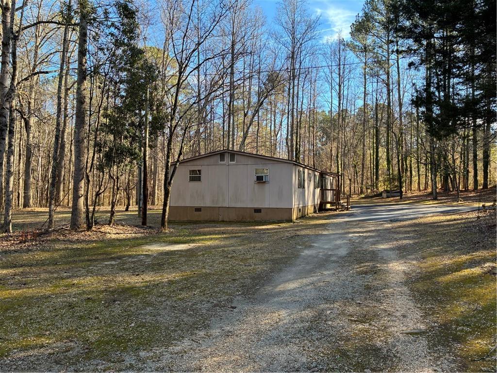 208 Manors Mill Road Dallas, GA 30157 - Photo 20 of 26 a backyard of apartments with large trees