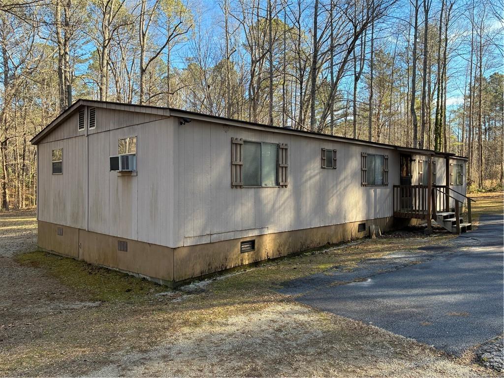 208 Manors Mill Road Dallas, GA 30157 - Photo 21 of 26 a side view of a house