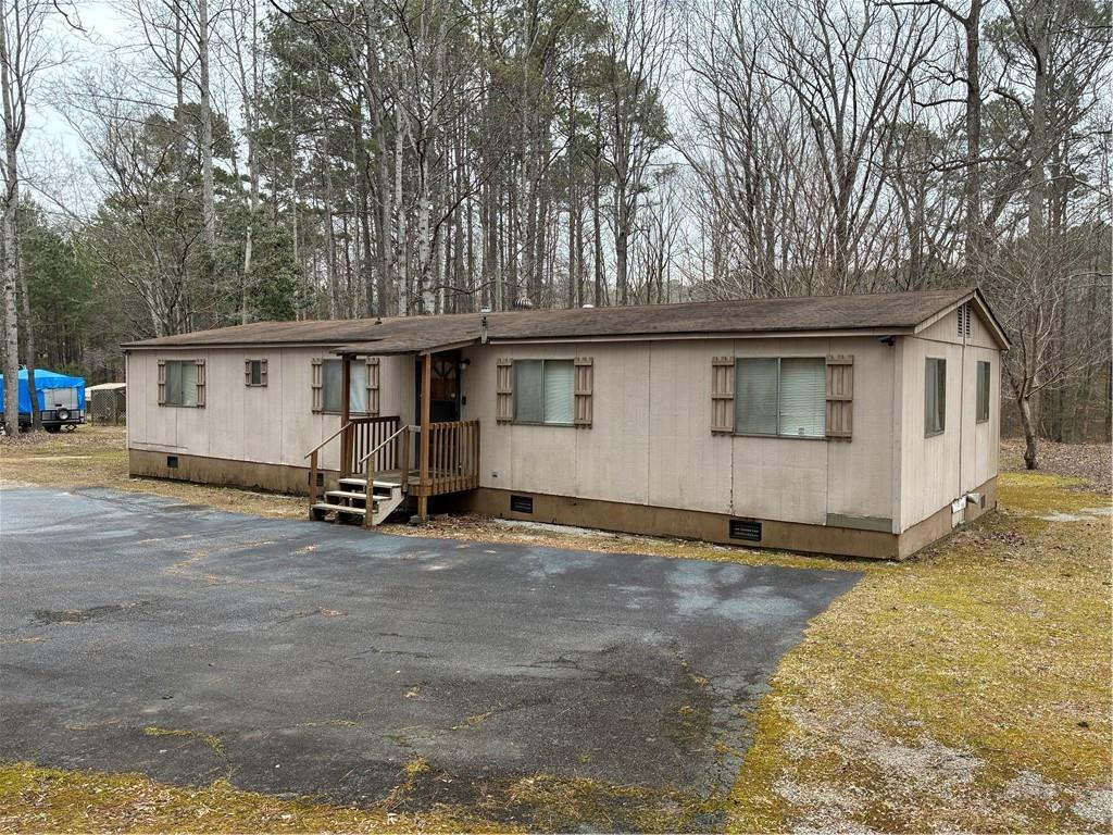 208 Manors Mill Road Dallas, GA 30157 - Photo 22 of 26 a view of a house with backyard
