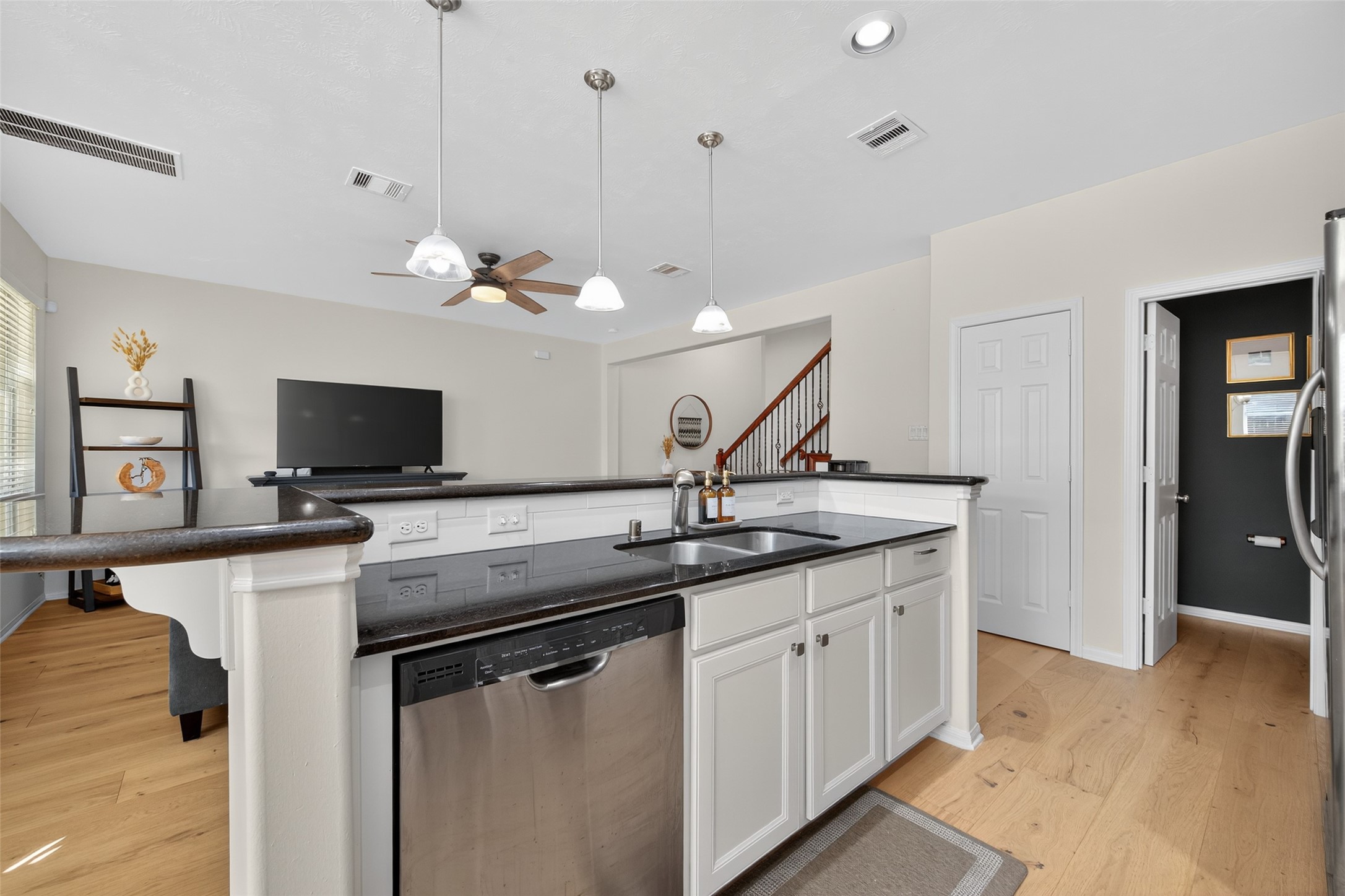 2806 Windy Thicket Lane Houston, TX 77082 - Photo 14 of 38 a kitchen with a sink and a refrigerator