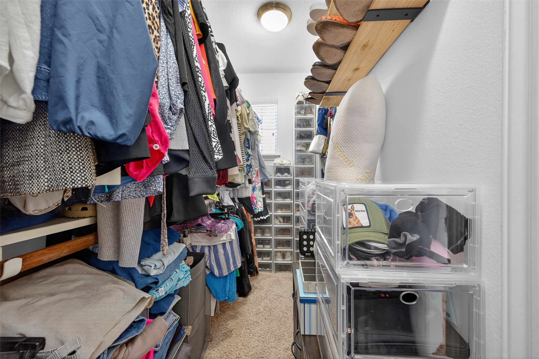 2806 Windy Thicket Lane Houston, TX 77082 - Photo 22 of 38 a view of walk in closet with clothes and shoes