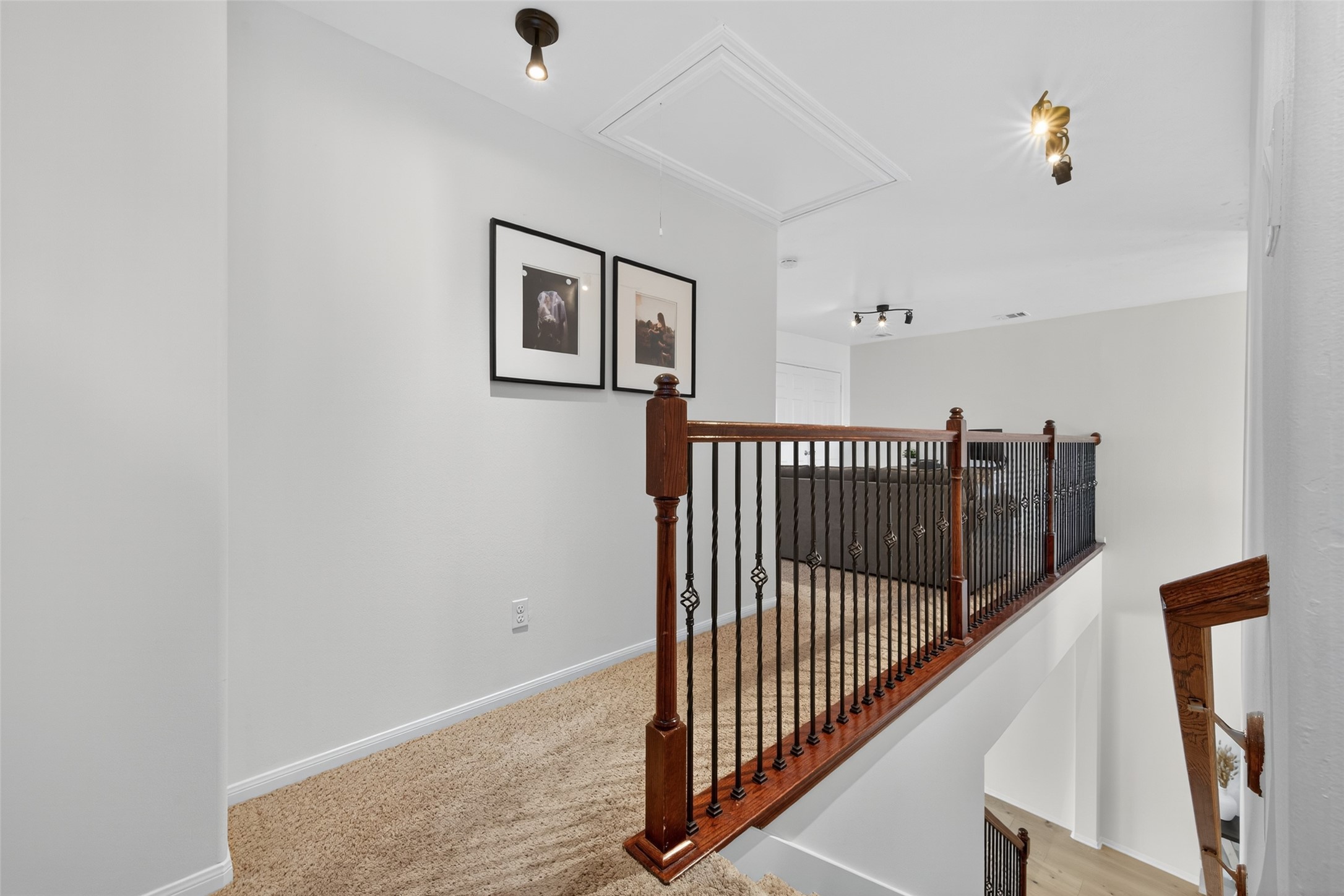 2806 Windy Thicket Lane Houston, TX 77082 - Photo 23 of 38 a view of a hallway with wooden floor and windows