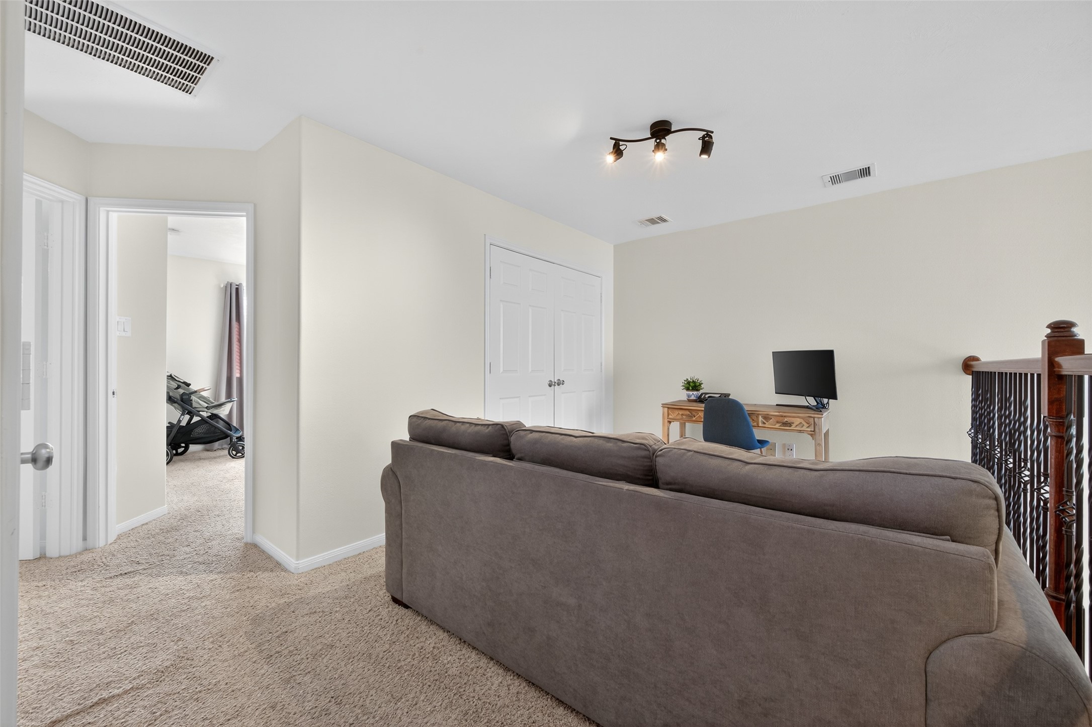 2806 Windy Thicket Lane Houston, TX 77082 - Photo 24 of 38 a living room with furniture and a walk in closet