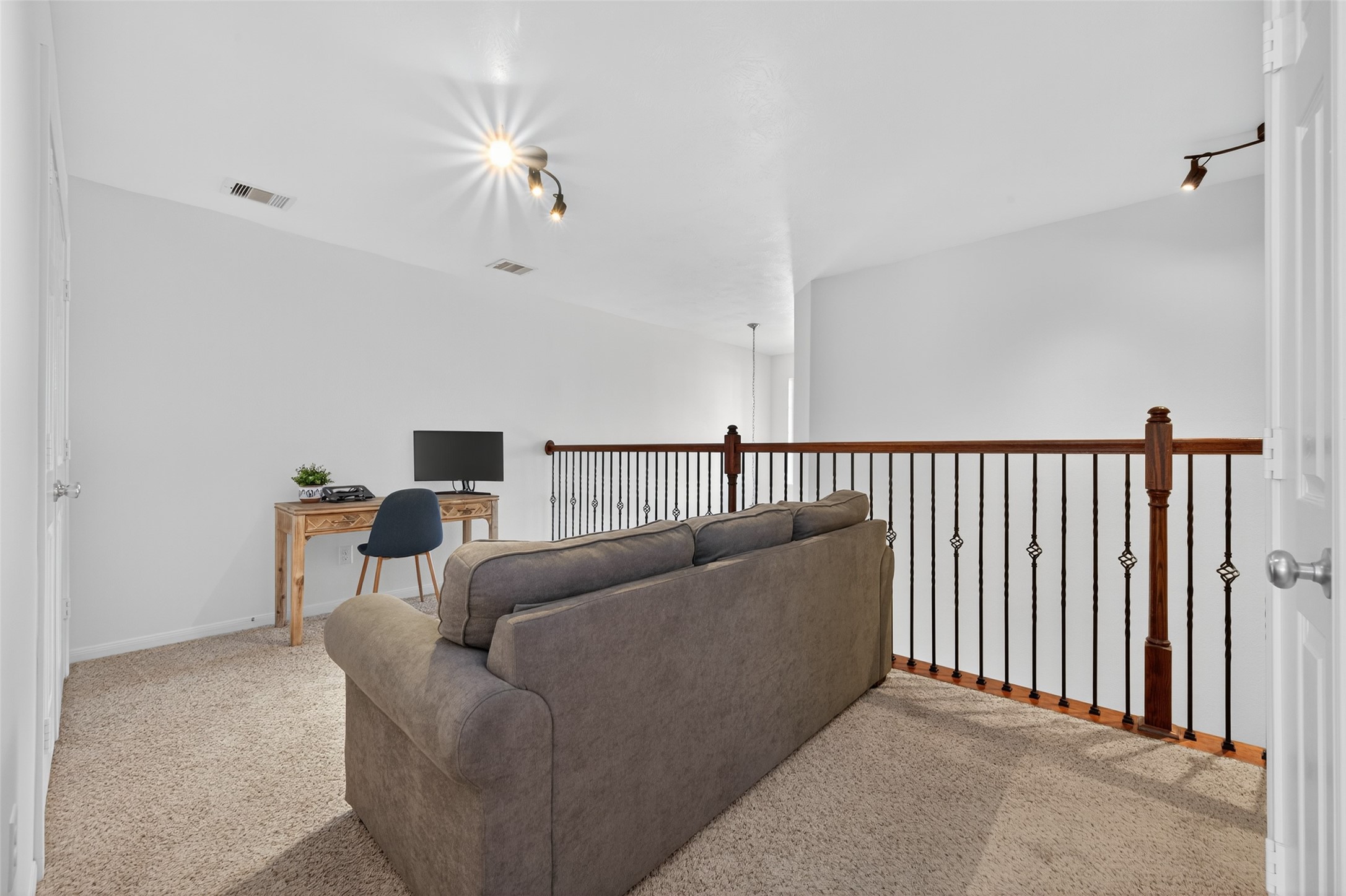 2806 Windy Thicket Lane Houston, TX 77082 - Photo 25 of 38 a living room with furniture and a chandelier