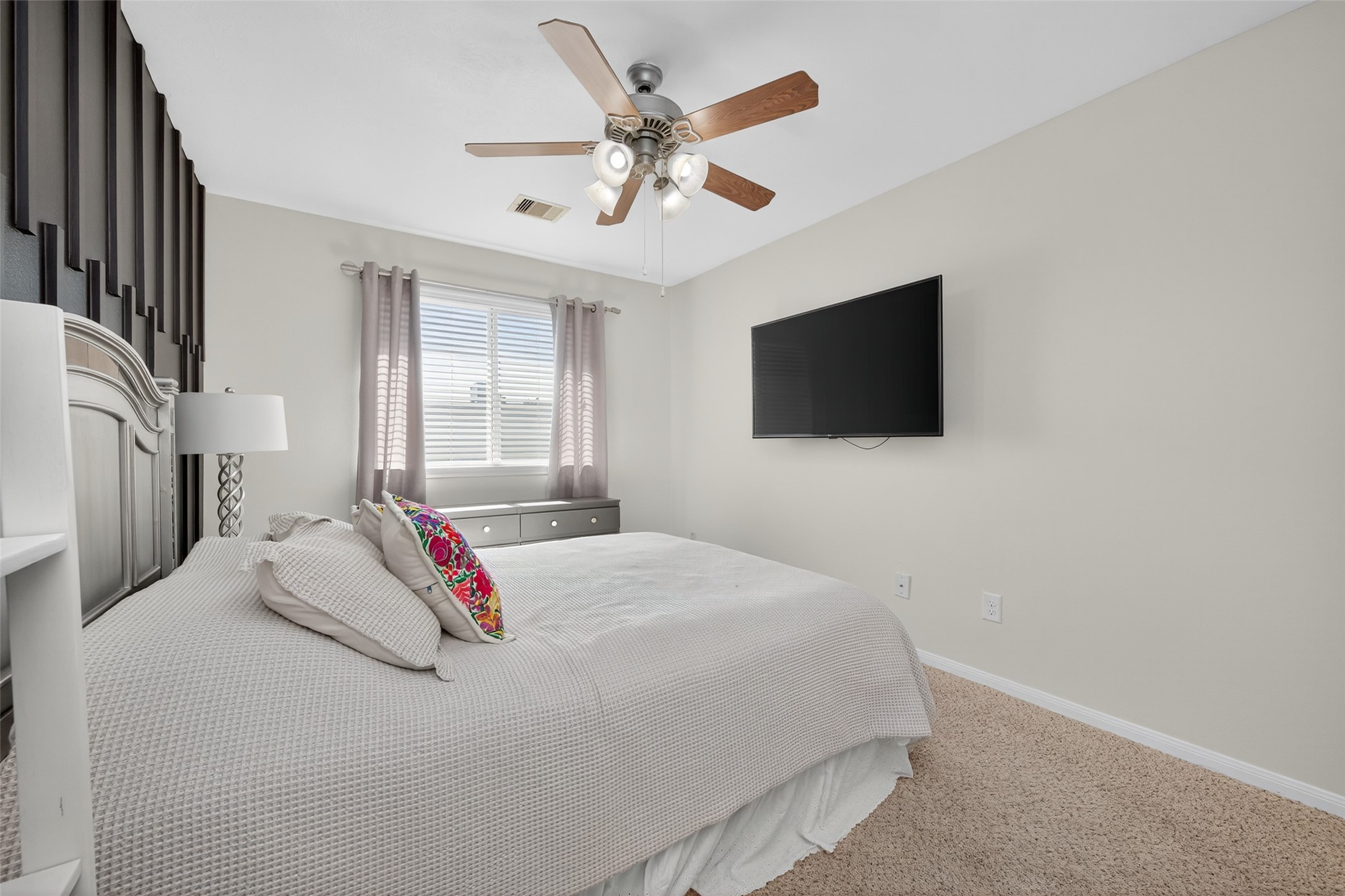 2806 Windy Thicket Lane Houston, TX 77082 - Photo 30 of 38 a bedroom with a bed and a flat screen tv