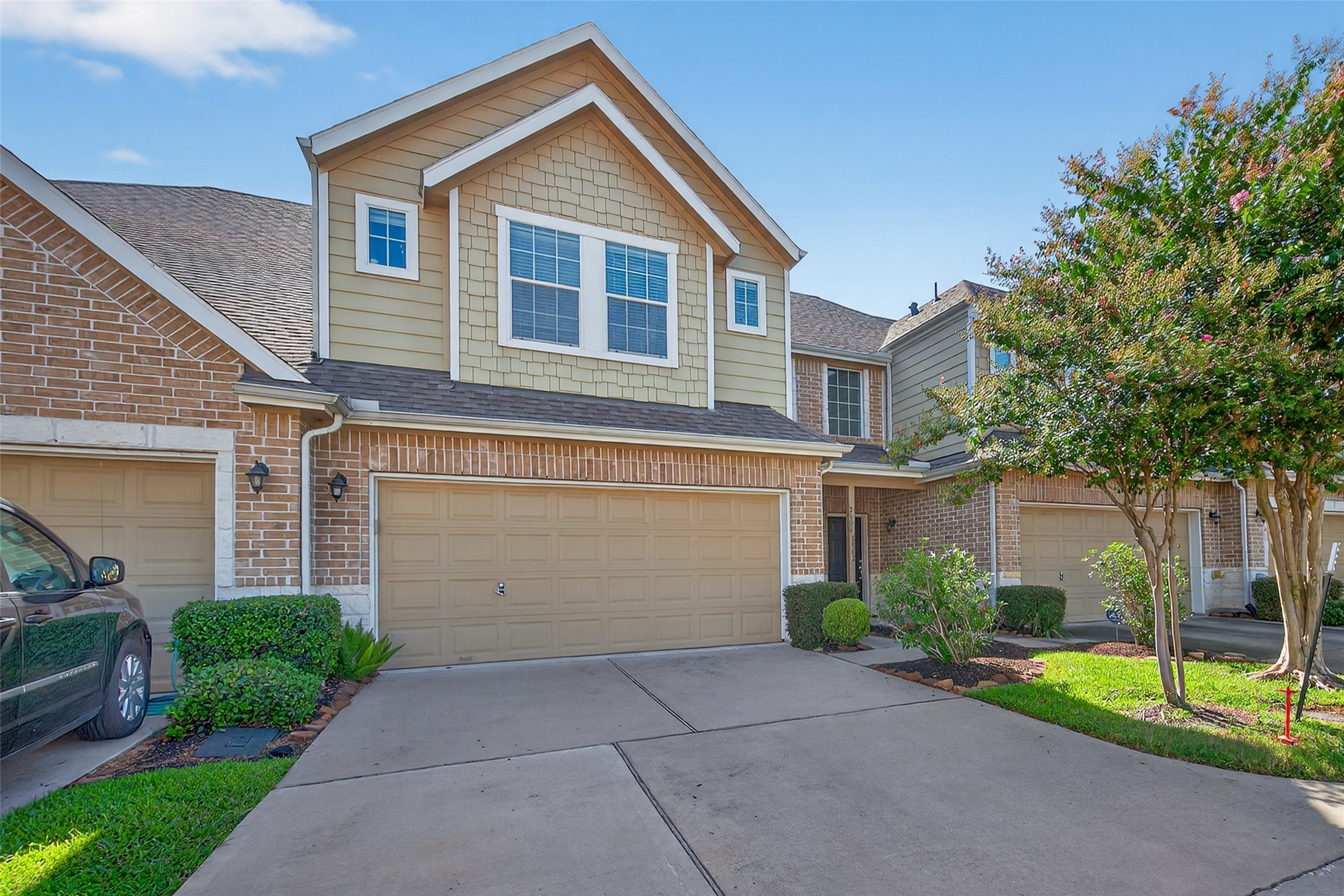 2806 Windy Thicket Lane Houston, TX 77082 - Photo 3 of 38 a front view of a house with a yard and garage