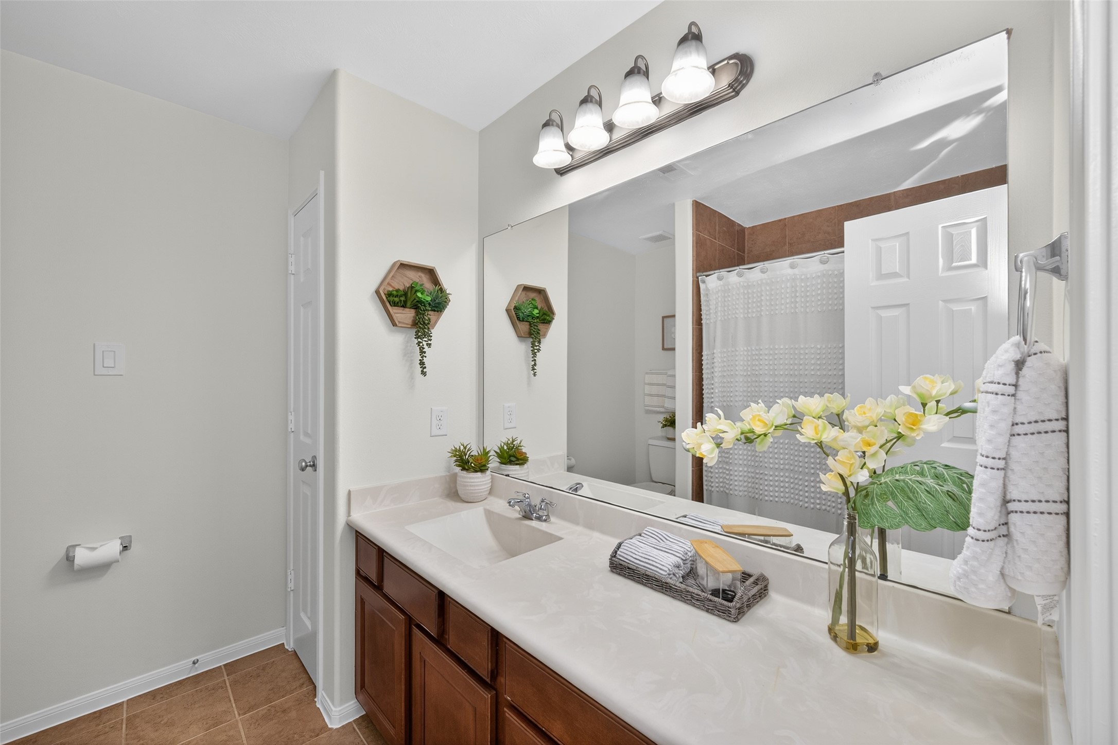 2806 Windy Thicket Lane Houston, TX 77082 - Photo 32 of 38 a bathroom with a sink a vanity and a mirror