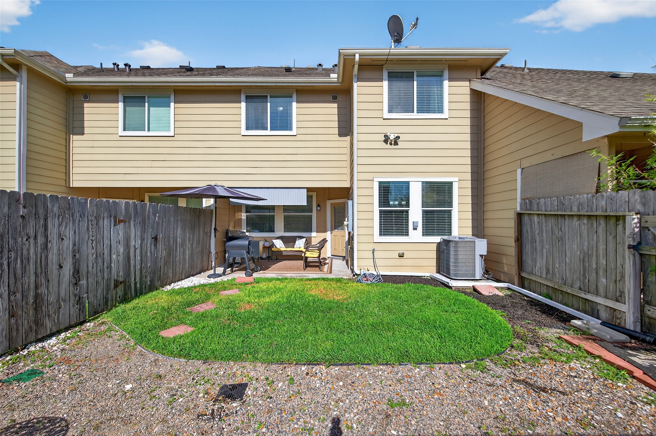 2806 Windy Thicket Lane Houston, TX 77082 - Photo 37 of 38 a view of a house with a small yard and wooden fence