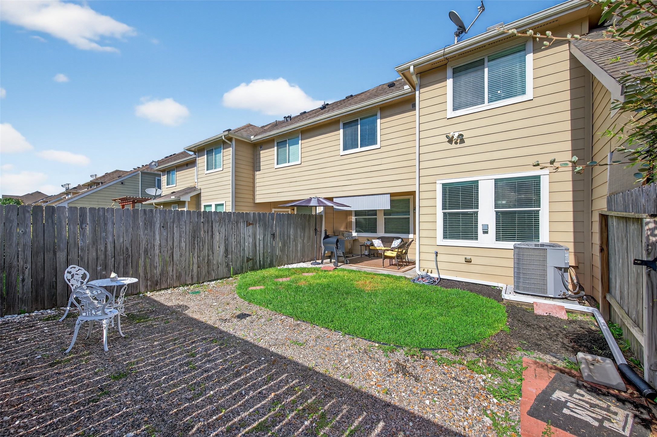 2806 Windy Thicket Lane Houston, TX 77082 - Photo 38 of 38 a backyard of a house with table and chairs