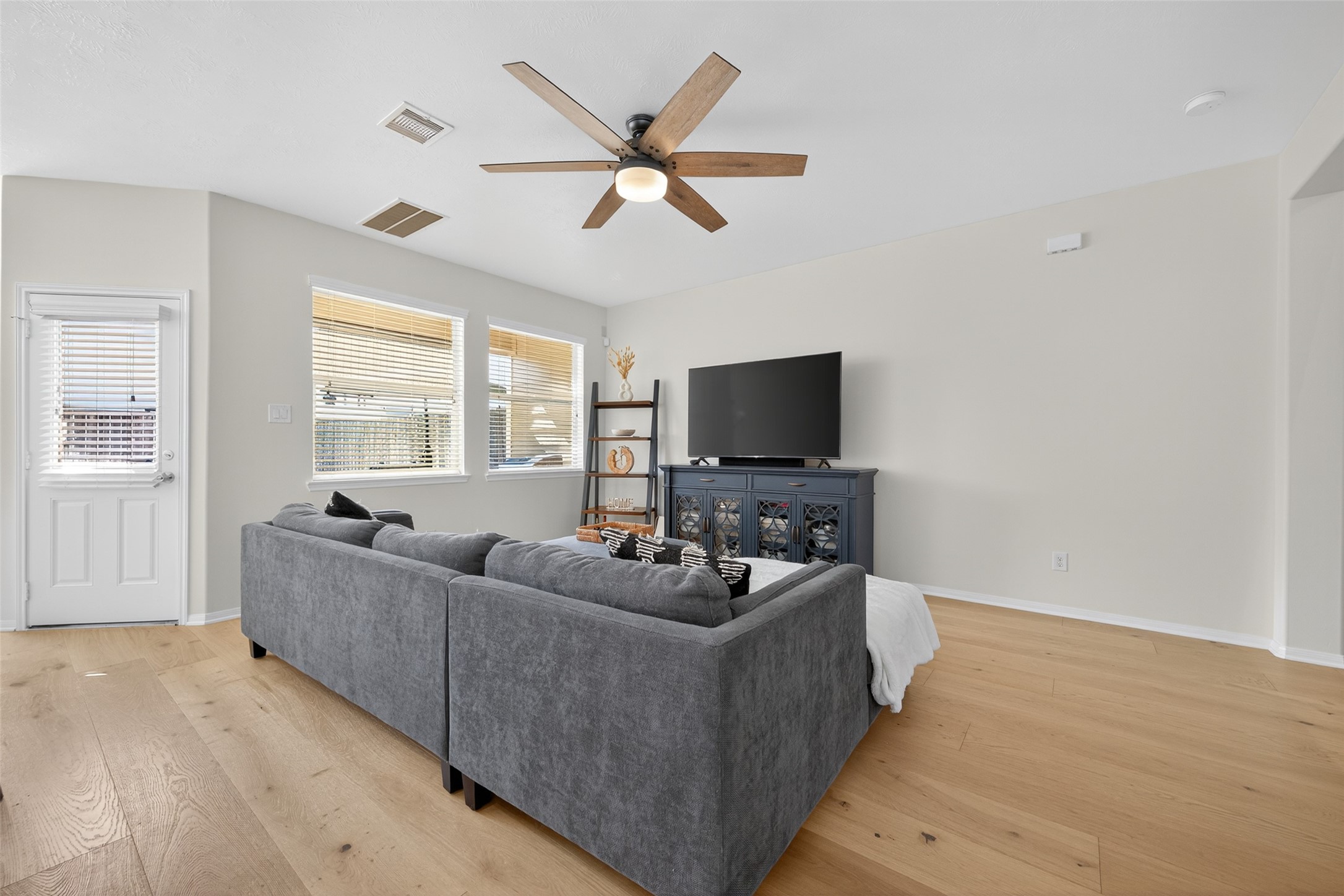 2806 Windy Thicket Lane Houston, TX 77082 - Photo 7 of 38 a living room with furniture and a flat screen tv