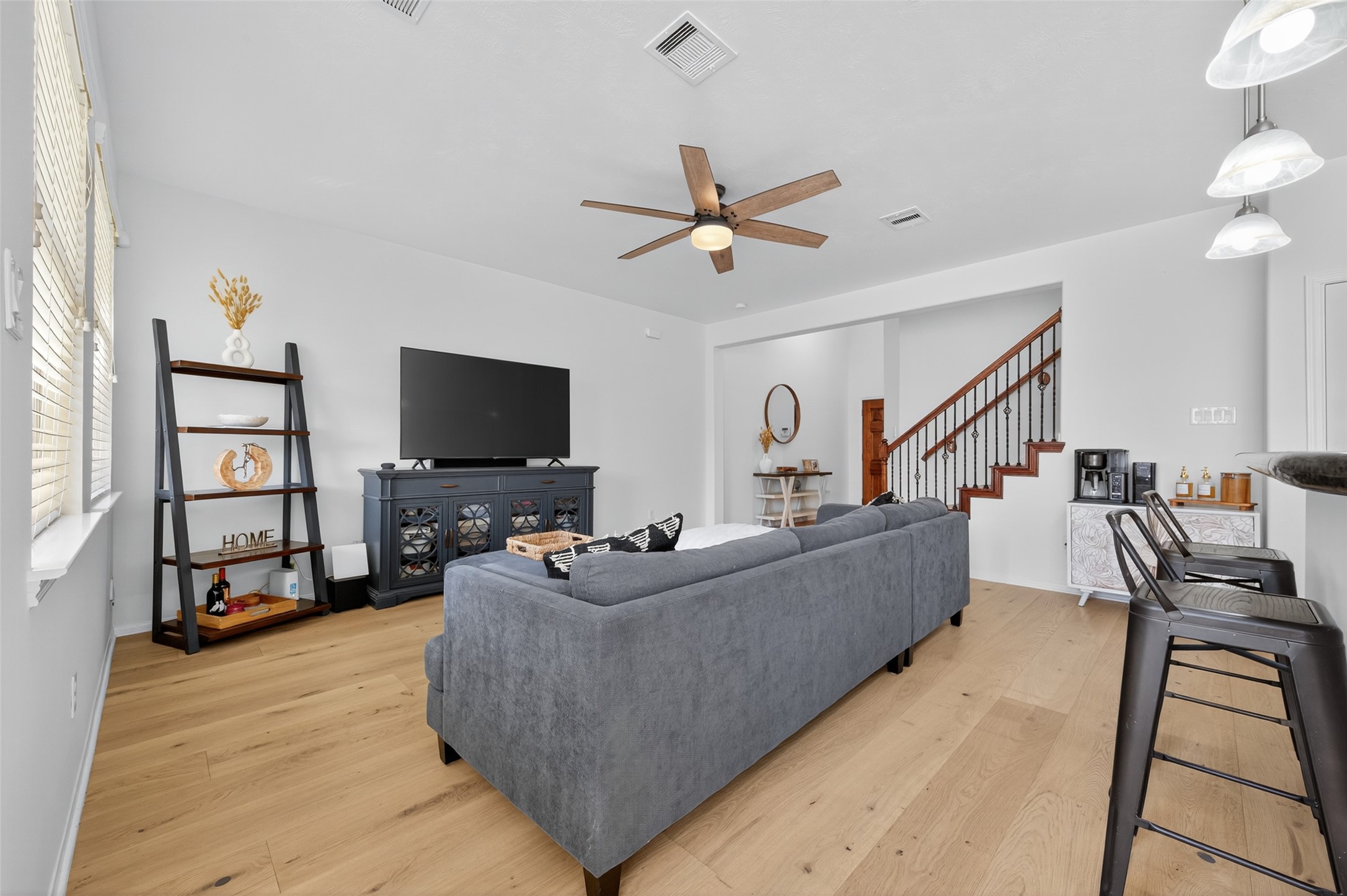 2806 Windy Thicket Lane Houston, TX 77082 - Photo 8 of 38 a living room with furniture and a flat screen tv