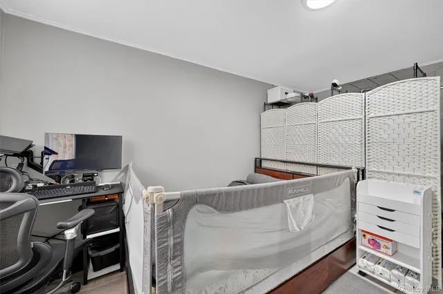 a bedroom with a bed and a couch