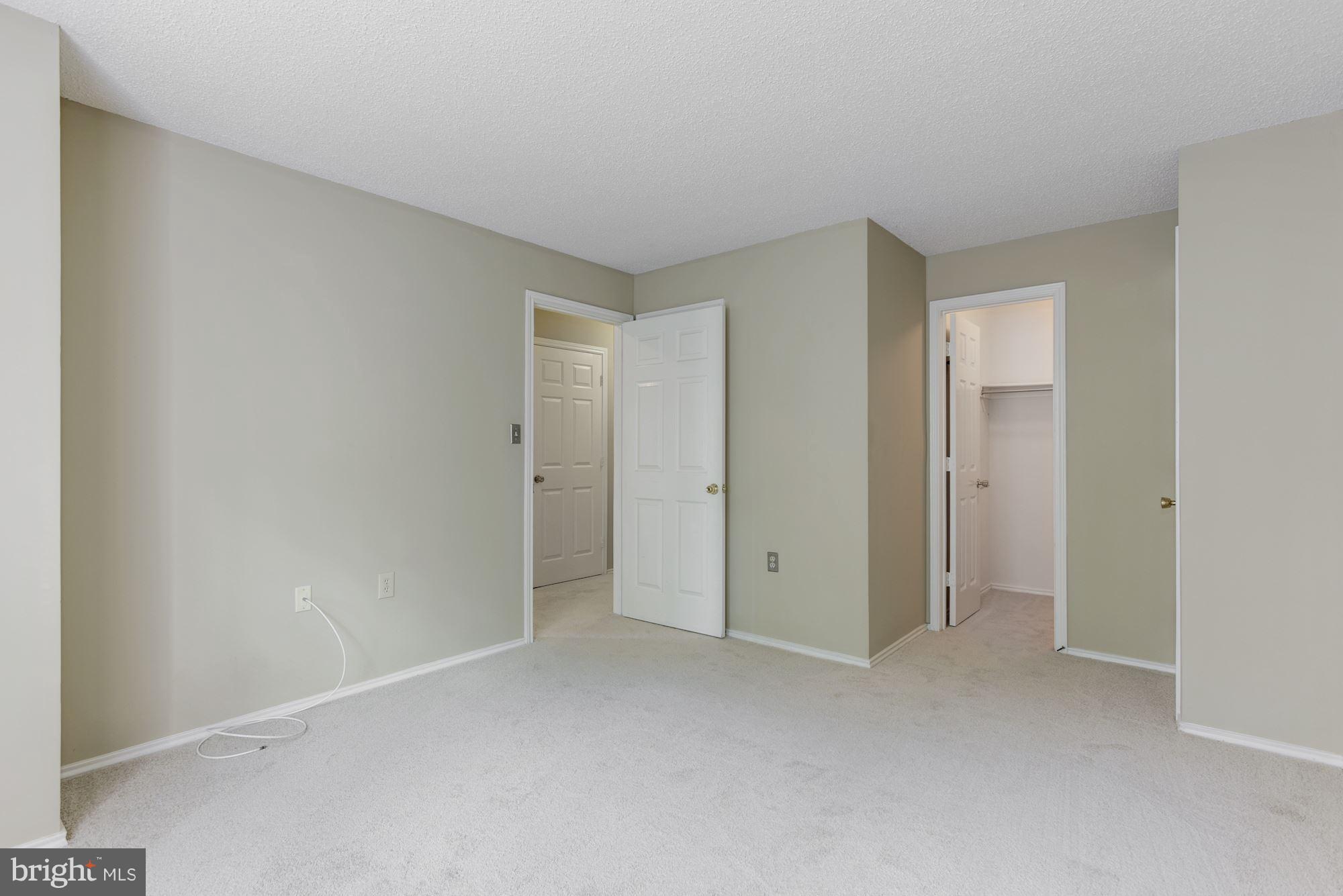 20963 Timber Ridge Terrace, Unit 202 Ashburn, VA 20147 - Photo 13 of 22 a view of an empty room