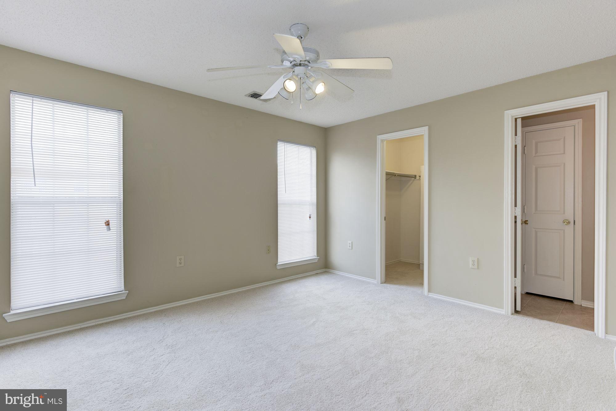 20963 Timber Ridge Terrace, Unit 202 Ashburn, VA 20147 - Photo 10 of 22 a view of an empty room with a window