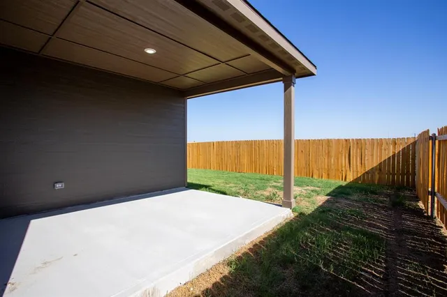 a view of a back yard from a room