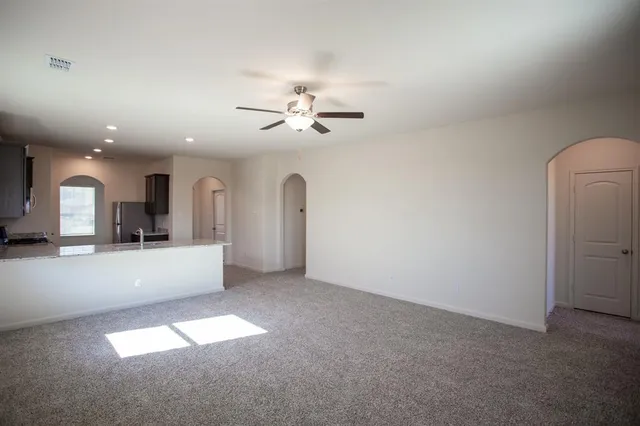 a view of a kitchen with a sink and a chandelier