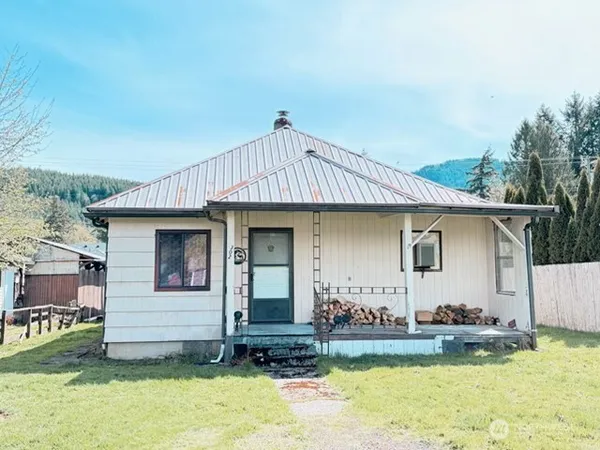 a front view of a house with a yard